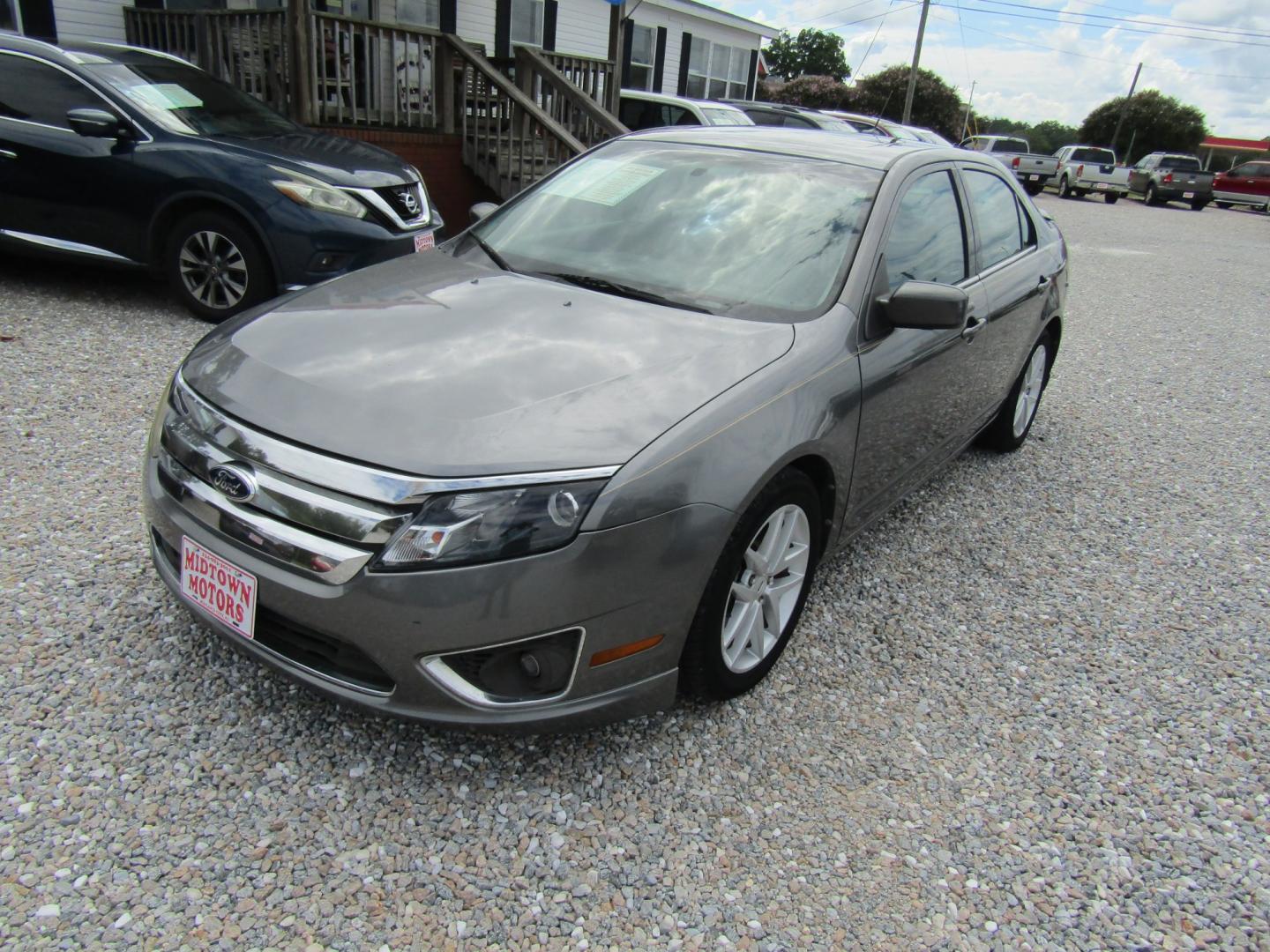 2012 Gray Ford Fusion SEL (3FAHP0JA9CR) with an 2.5L L4 DOHC 16V engine, Automatic transmission, located at 15016 S Hwy 231, Midland City, AL, 36350, (334) 983-3001, 31.306210, -85.495277- Photo#1
