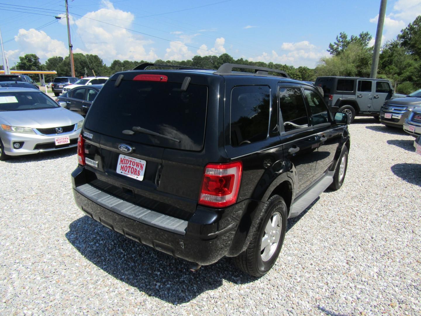 2012 Black Ford Escape XLT FWD (1FMCU0D74CK) with an 2.5L L4 DOHC 16V engine, Automatic transmission, located at 15016 S Hwy 231, Midland City, AL, 36350, (334) 983-3001, 31.306210, -85.495277- Photo#7