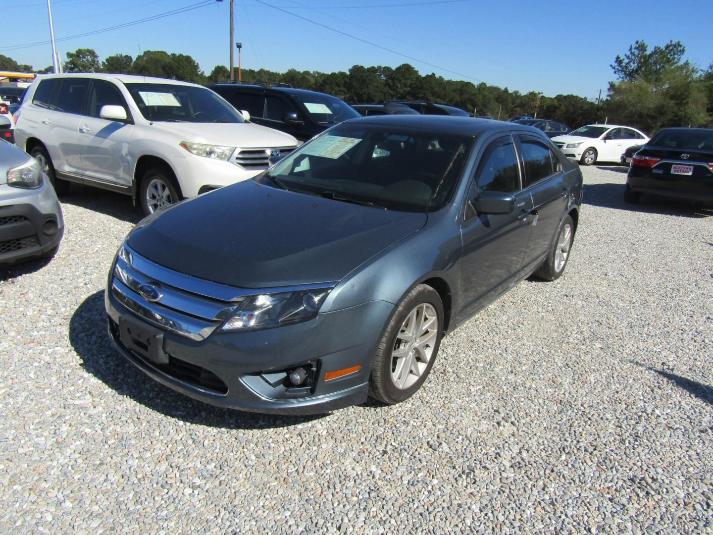 2012 Blue Ford Fusion SEL (3FAHP0JA9CR) with an 2.5L L4 DOHC 16V engine, Automatic transmission, located at 15016 S Hwy 231, Midland City, AL, 36350, (334) 983-3001, 31.306210, -85.495277- Photo#2