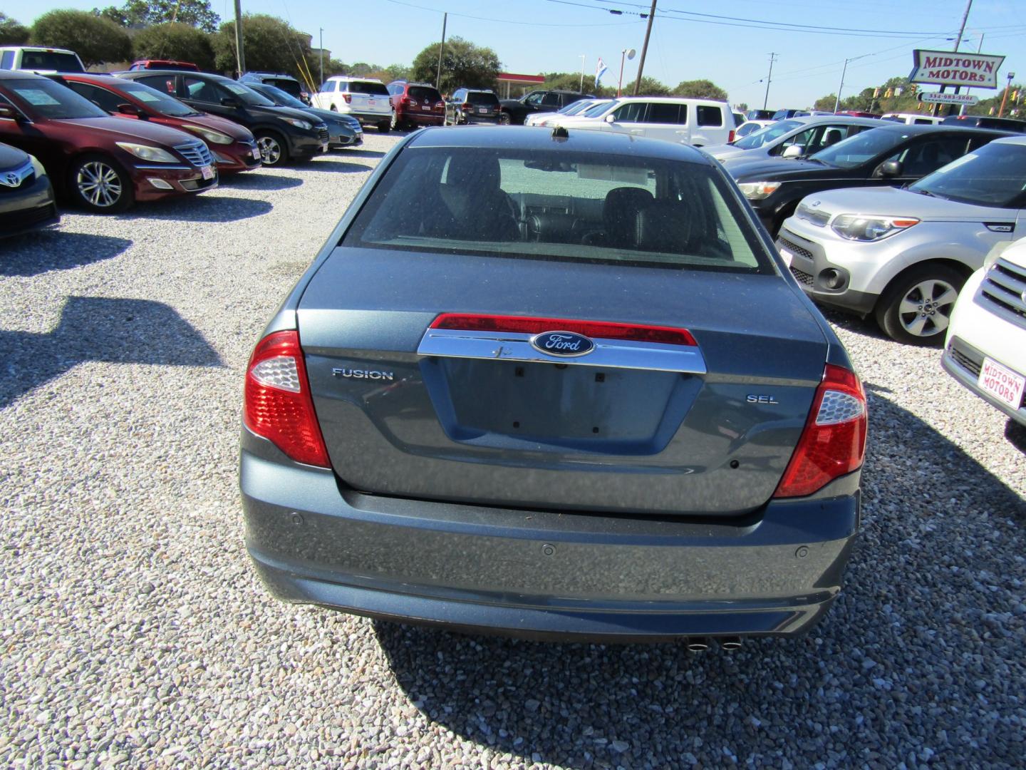 2012 Blue Ford Fusion SEL (3FAHP0JA9CR) with an 2.5L L4 DOHC 16V engine, Automatic transmission, located at 15016 S Hwy 231, Midland City, AL, 36350, (334) 983-3001, 31.306210, -85.495277- Photo#6