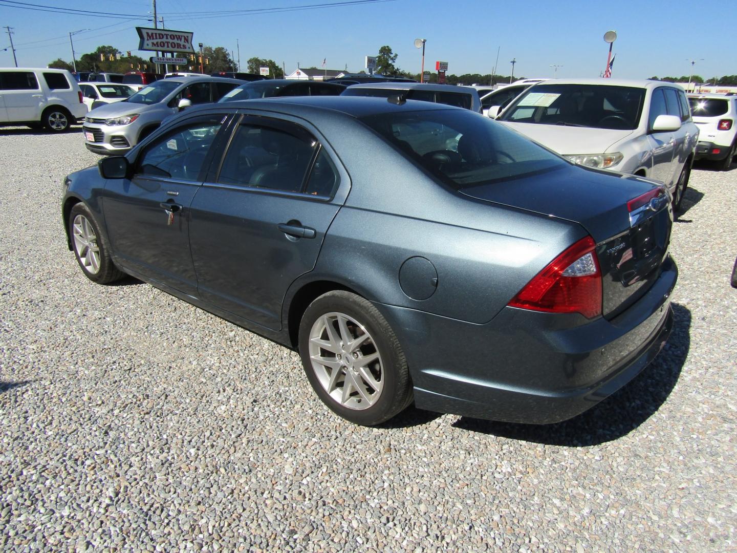 2012 Blue Ford Fusion SEL (3FAHP0JA9CR) with an 2.5L L4 DOHC 16V engine, Automatic transmission, located at 15016 S Hwy 231, Midland City, AL, 36350, (334) 983-3001, 31.306210, -85.495277- Photo#5