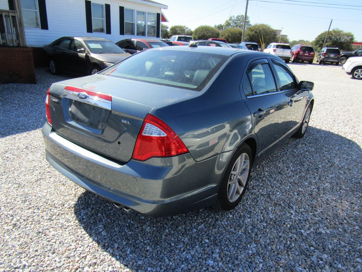 2012 Blue Ford Fusion SEL (3FAHP0JA9CR) with an 2.5L L4 DOHC 16V engine, Automatic transmission, located at 15016 S Hwy 231, Midland City, AL, 36350, (334) 983-3001, 31.306210, -85.495277- Photo#7