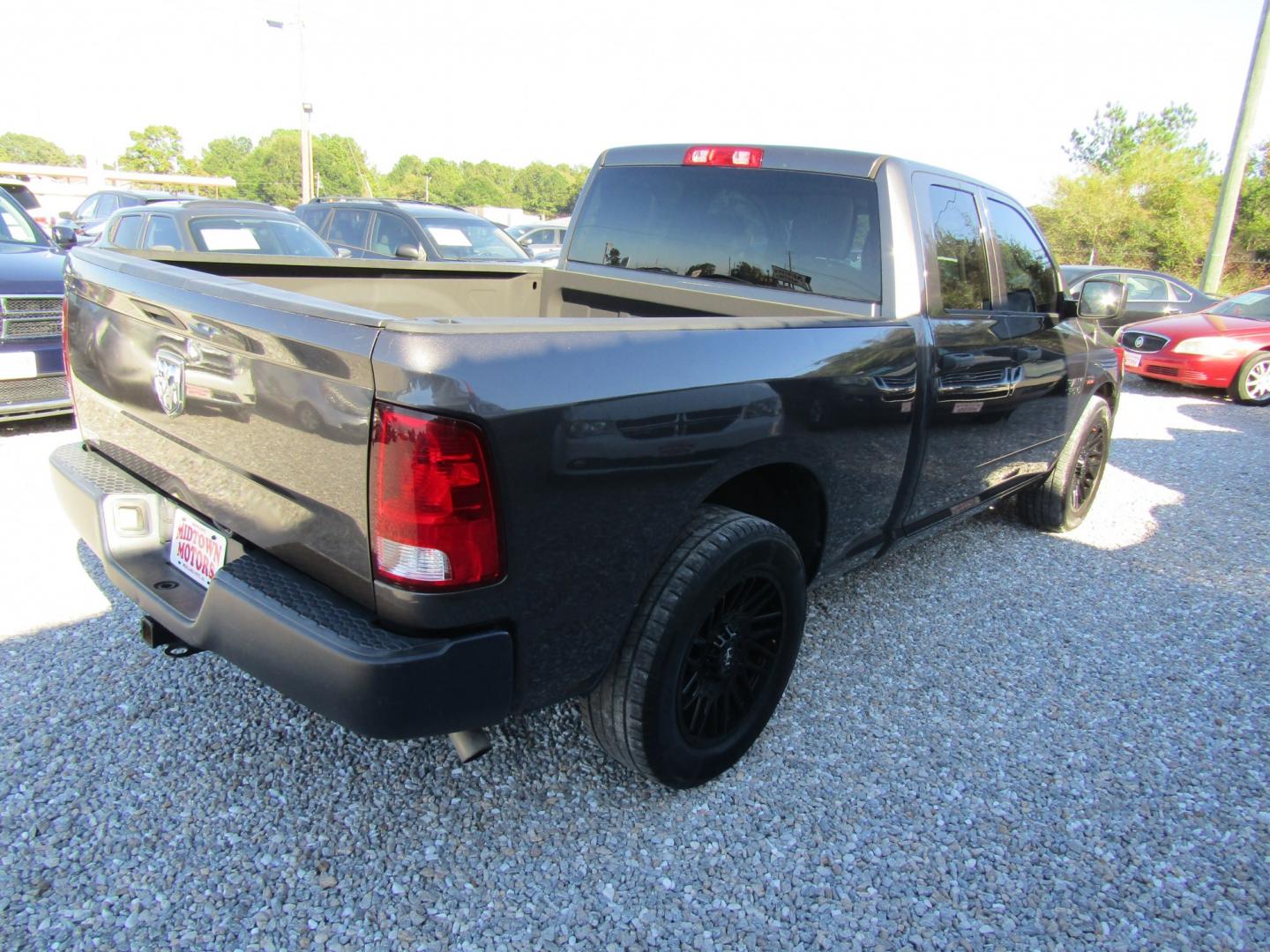 2019 Gray Ram 1500 Tradesman Quad Cab 2WD (1C6RR6FT4KS) with an 5.7L V8 OHV 16V engine, Automatic transmission, located at 15016 S Hwy 231, Midland City, AL, 36350, (334) 983-3001, 31.306210, -85.495277- Photo#7